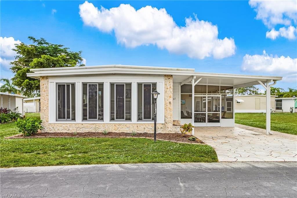 Image 3: Florida room in front and large screened room off of carport