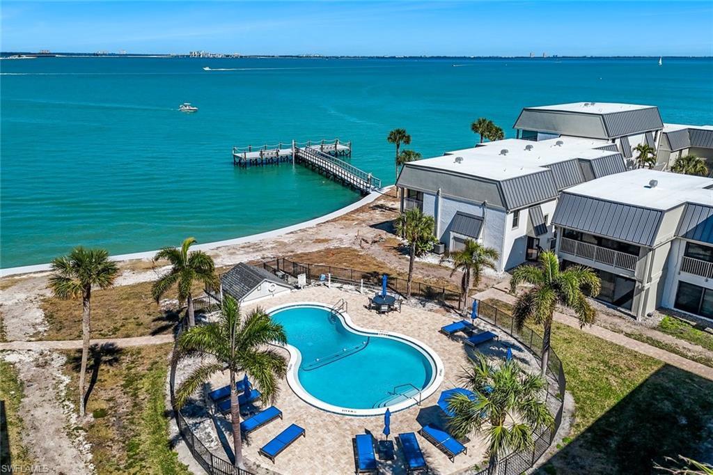 Image 2: Drone / aerial view of a large body of water and a pool