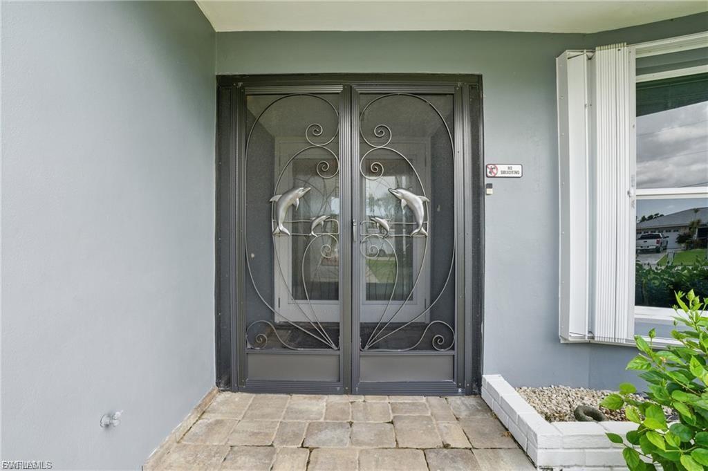 Image 3: Doorway to property with stucco siding