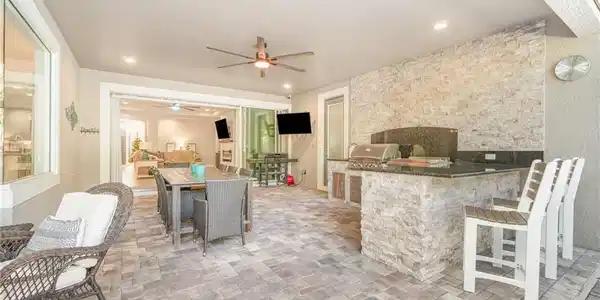 Image 2: Lanai with Outdoor Grilling Station & Plenty of Room for Entertaining
