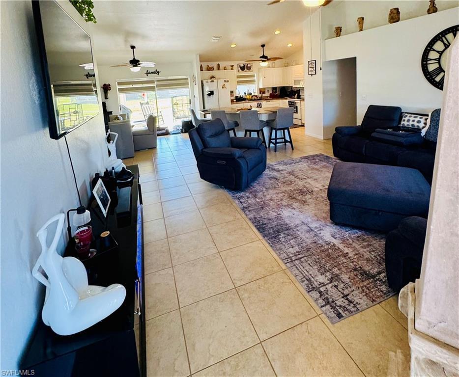 Image 2: Living area with ceramic tile floors.