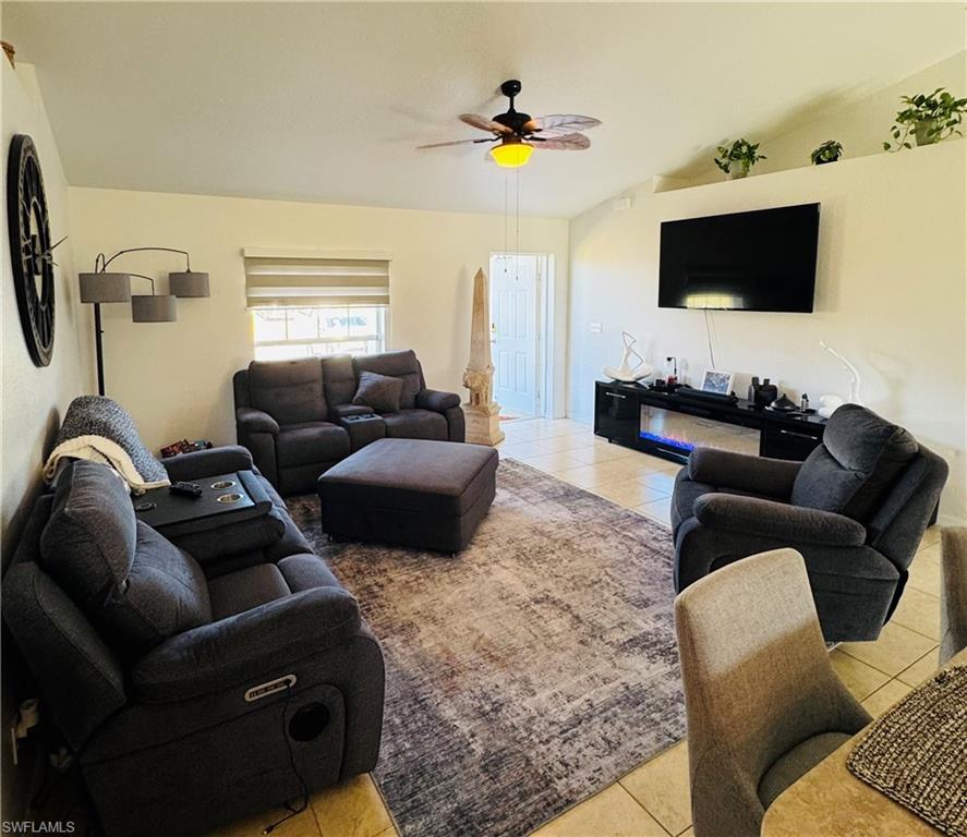 Image 3: Living room with ceramic tile floors.