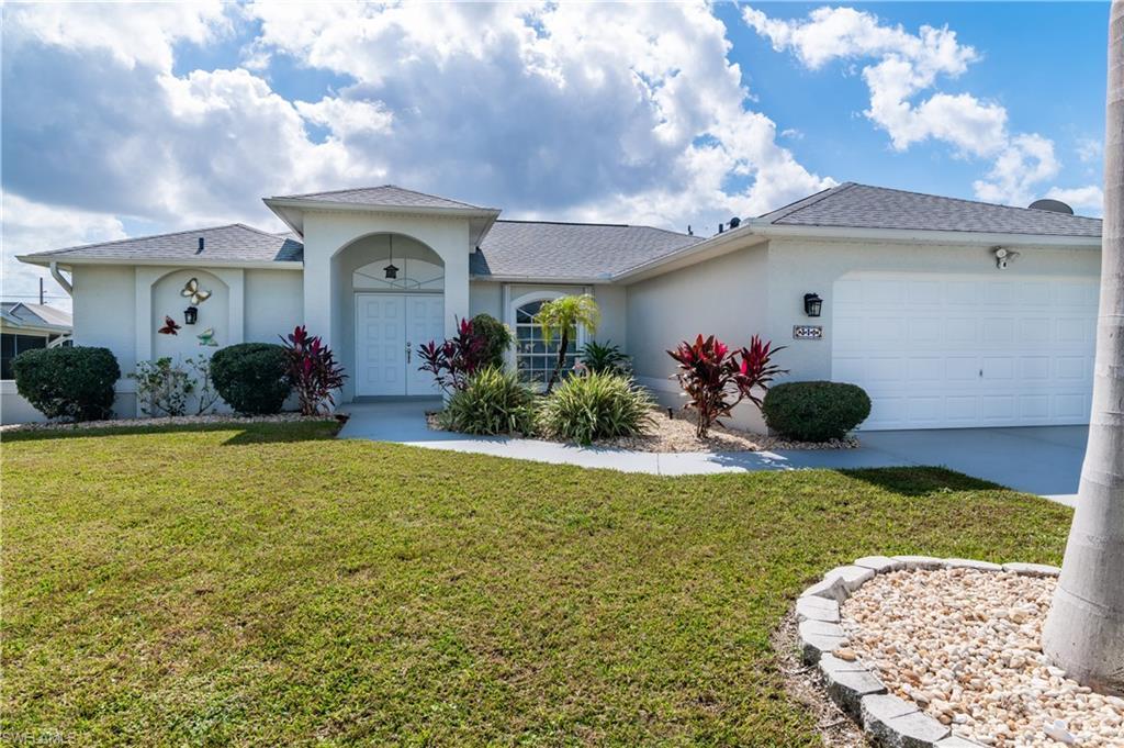 Image 1: Ranch-style home with stucco siding, roof with shingles, a front yard, and a garage