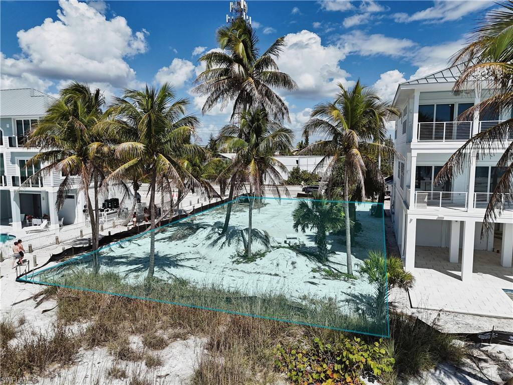 Image 2: View of pool with patio surround, a pool, and a balcony