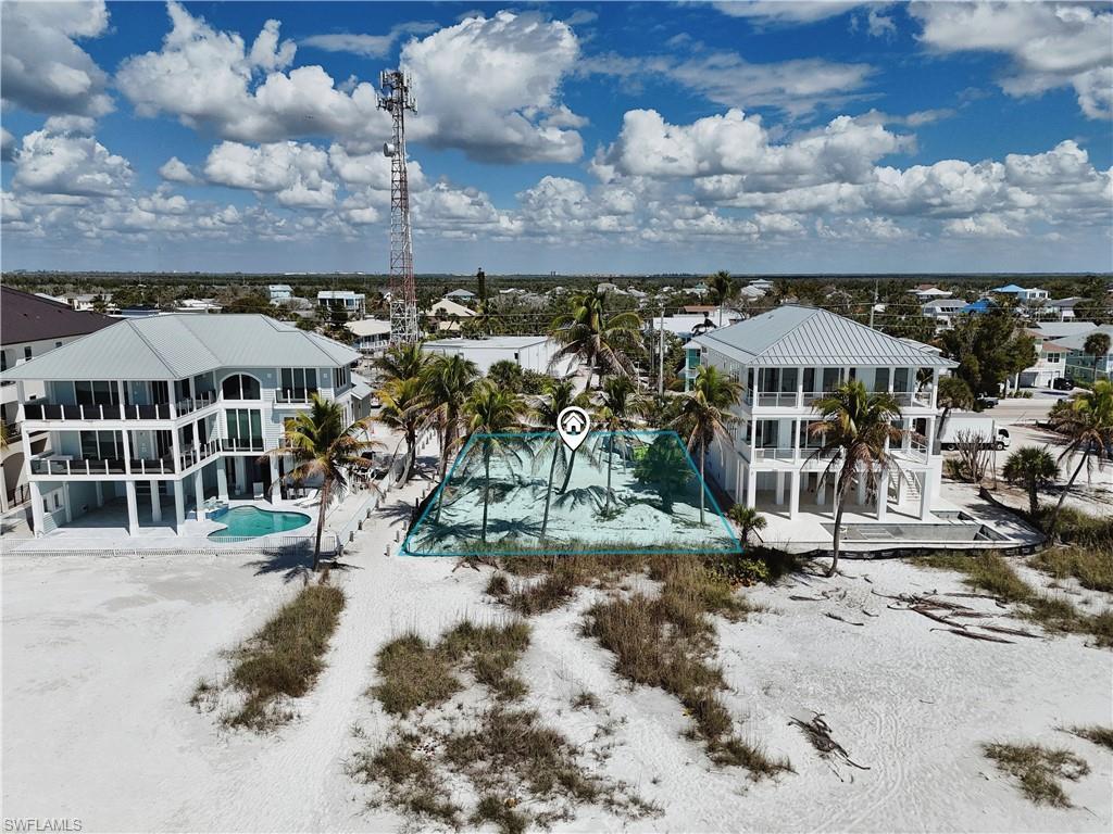 Image 3: Aerial view of residential area with a pool area