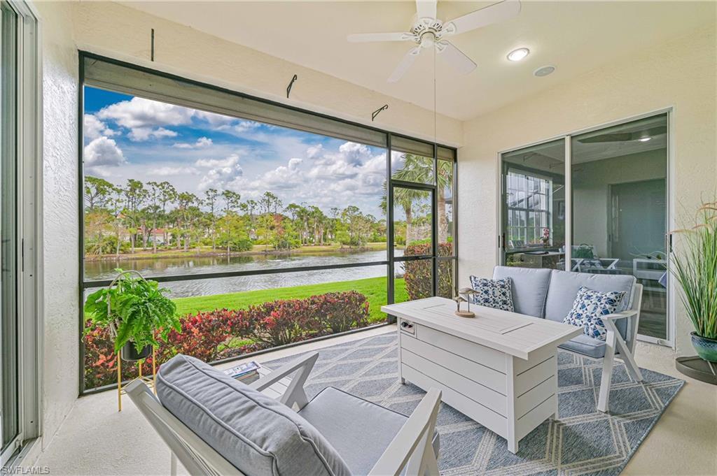 Image 4: Sunroom / solarium with outdoor lounge area, ceiling fan, and a water view