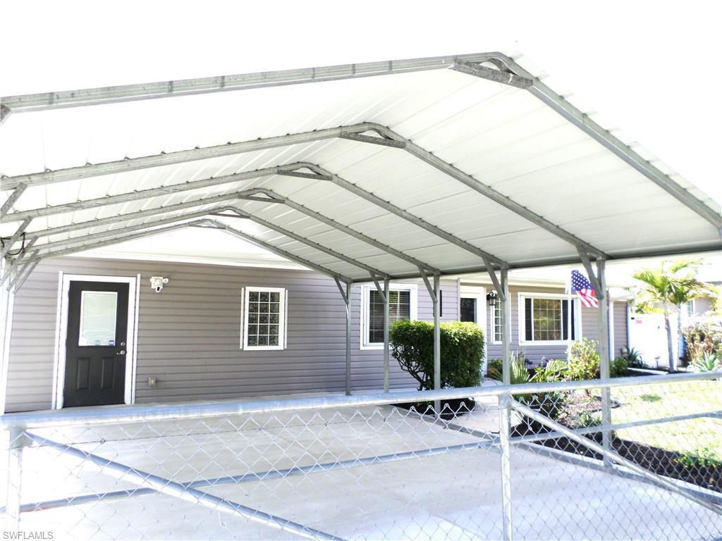 Image 2: Double Over Size Attached Carport With Cement Driveway.