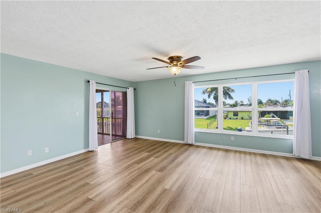 Image 4: Beautiful new, tilt in, living room windows are impact resistant for protection in storms and to reduce noise. Sliders on left provide access to all season lanai and back stairway.