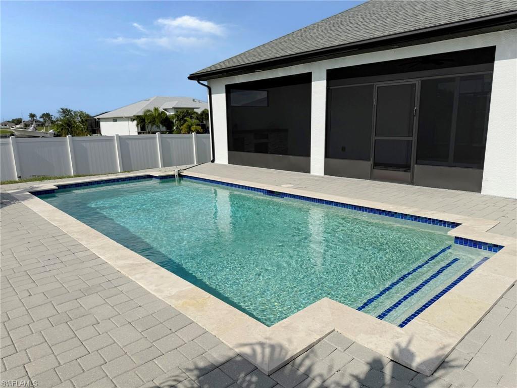Image 3: Pool with Outdoor Shower. Fenced Yard. Huge Patio Area.