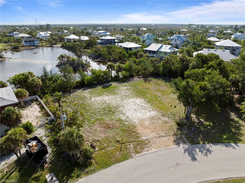 Image 2: Cleared land parcel with partial tree coverage