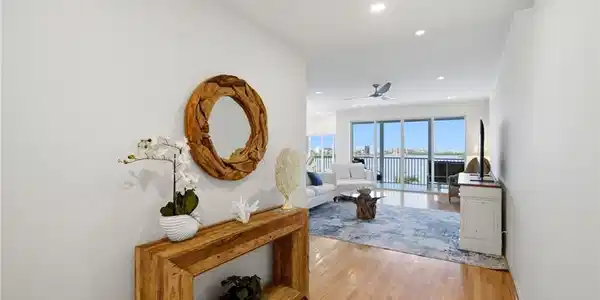 Image 3: As you pass through the elegant double-door entry, your gaze is immediately drawn to the breathtaking, uninterrupted vistas beyond.