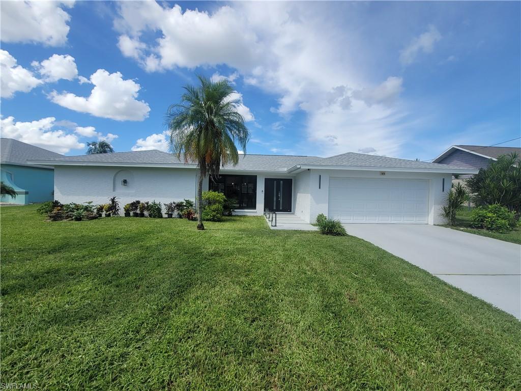 Image 2: Single story home featuring driveway, an attached garage, stucco siding, and a front yard