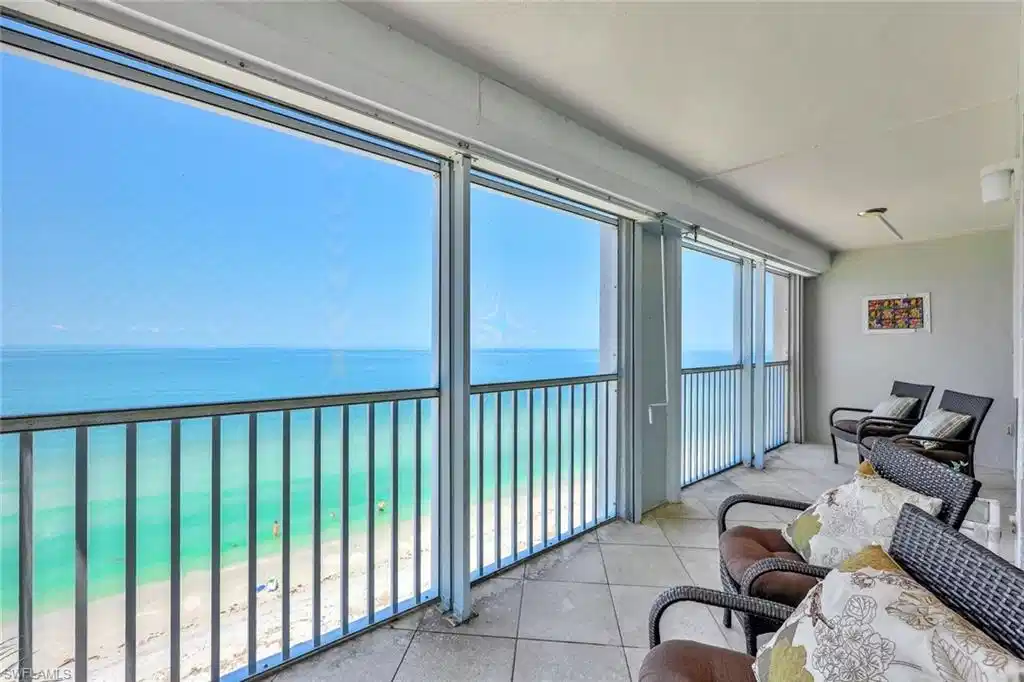 Image 1: Sunroom featuring a water view