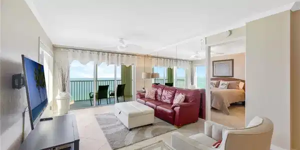 Image 4: Living room featuring crown molding, ceiling fan, and light tile floors