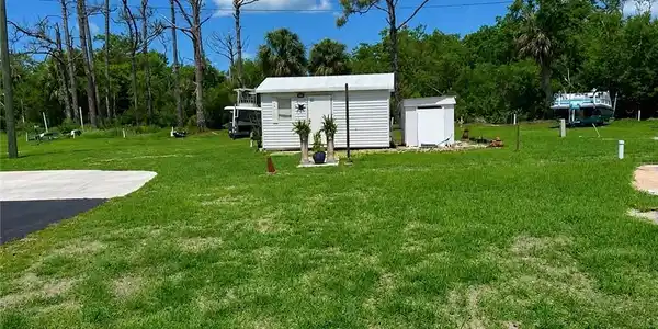 Image 3: View of lot featuring a storage unit