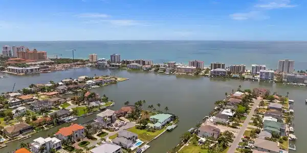 Image 2: Aerial view of the home with expansive bay and gulf views