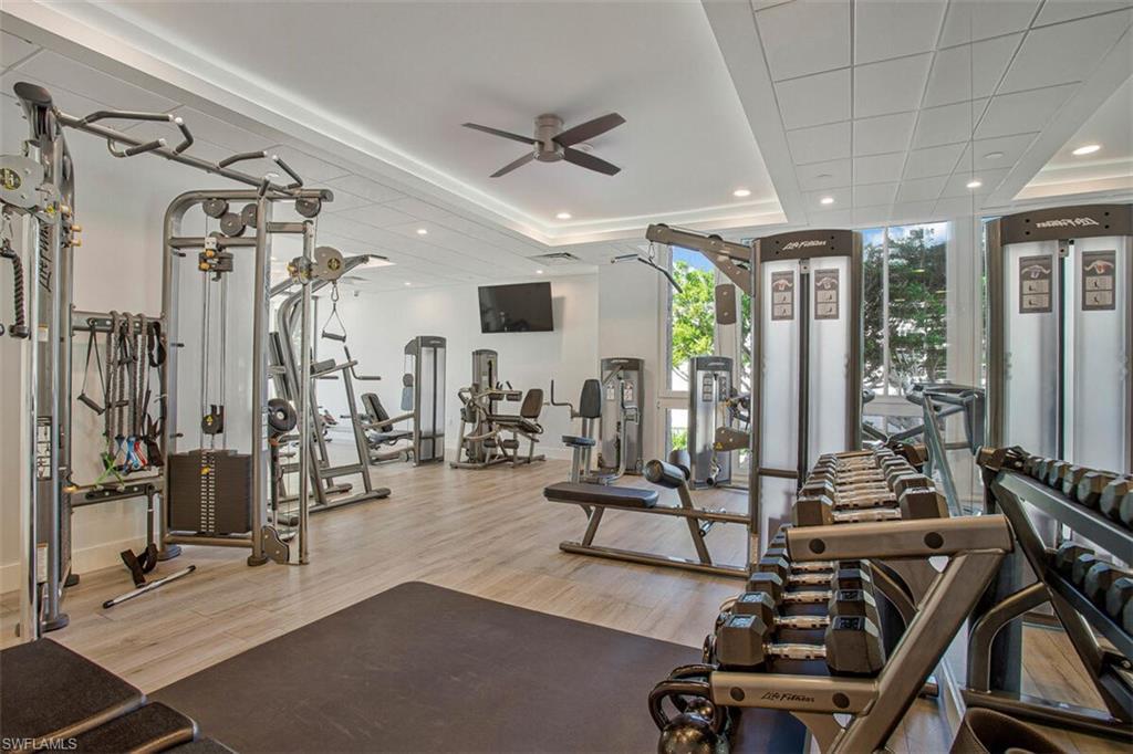 Image 4: Gym with recessed lighting, ceiling fan, and expansive windows