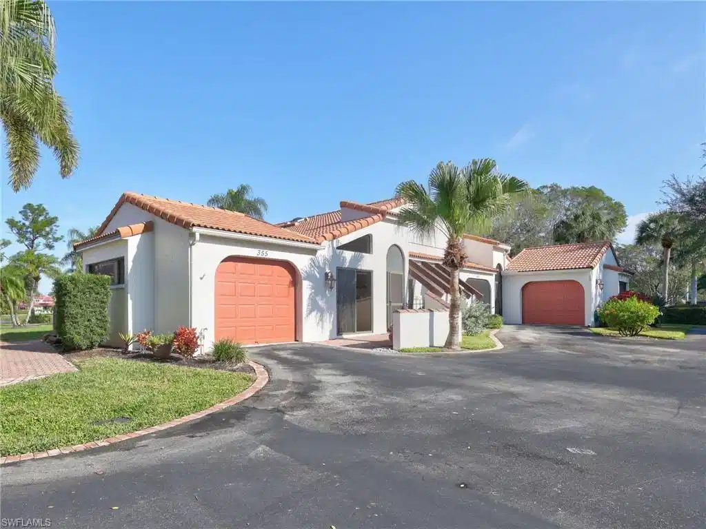 Image 1: Driveway to attached garage