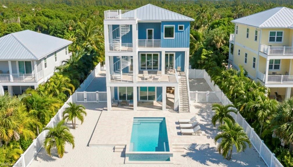 Image 2: Rear 3D rendering of house with pool area, expansive decks & multiple levels - virtually enhanced