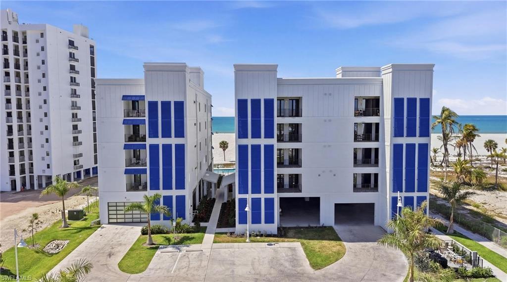 Image 1: View of apartment building / complex featuring a water view