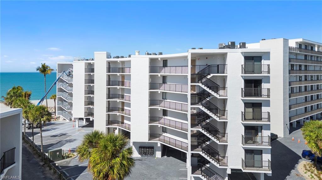 Image 3: View of apartment building / complex featuring a water view