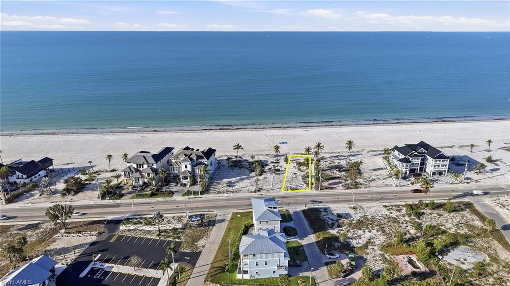 Image 4: Aerial view of residential area with waterfront with a beach - Virtually Edited Image