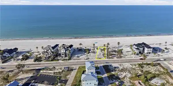 Image 4: Aerial view of residential area with waterfront with a beach - Virtually Edited Image