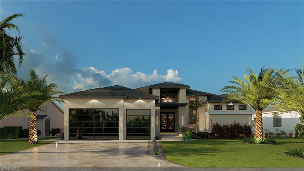 Image 1: View of front of property with stucco siding, driveway, french doors, a front lawn, and a garage