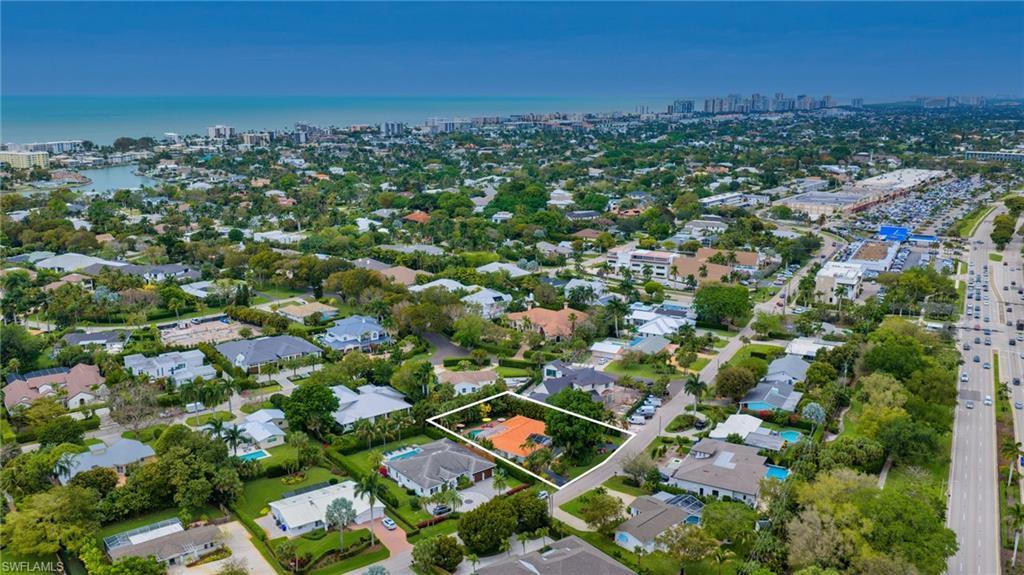 Image 2: Aerial view of property's location with property parcel outlined and nearby suburban area