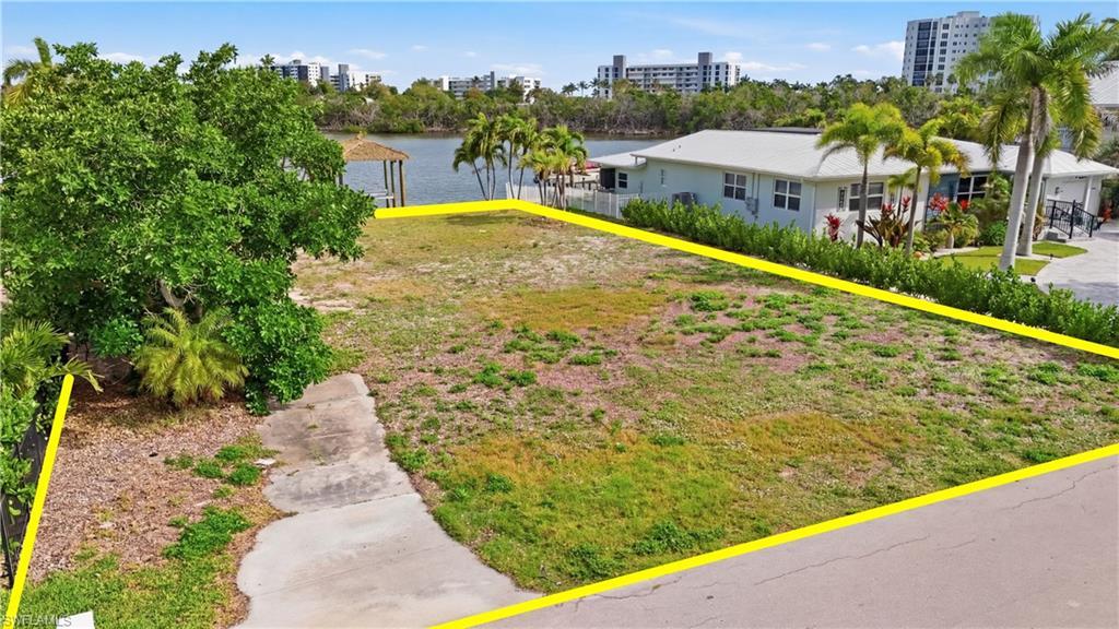 Image 2: View of yard featuring a water view - Virtually Edited Image