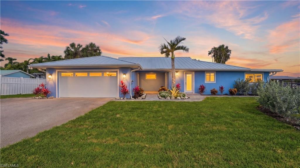 Image 2: Front of home with evening lighting