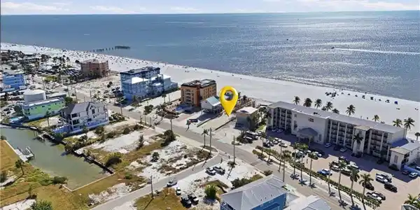 Image 2: Bird's eye view of waterfront with a beach - Virtually Edited Image