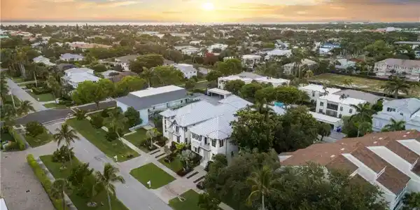 Image 2: Aerial view at dusk of a residential view