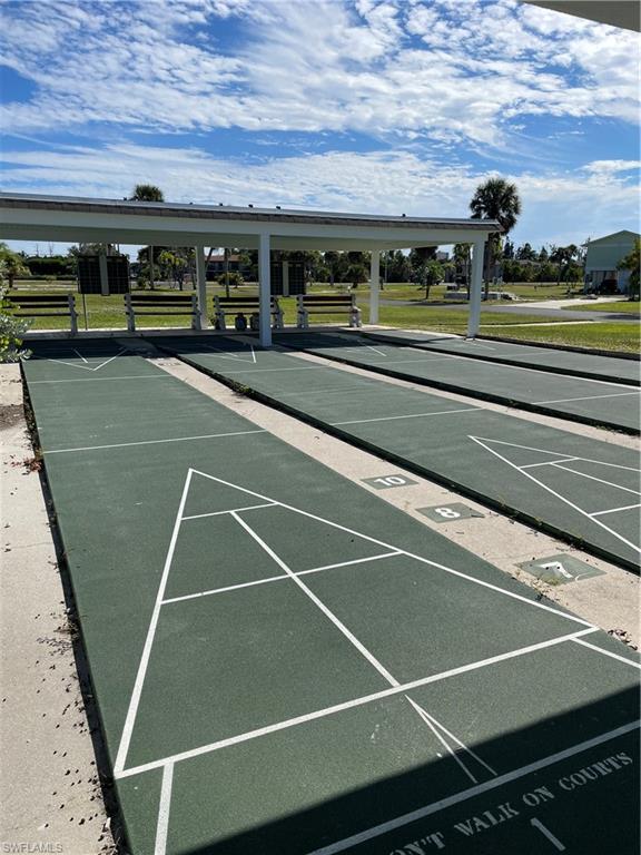 Image 4: Surrounding community featuring shuffleboard and a lawn