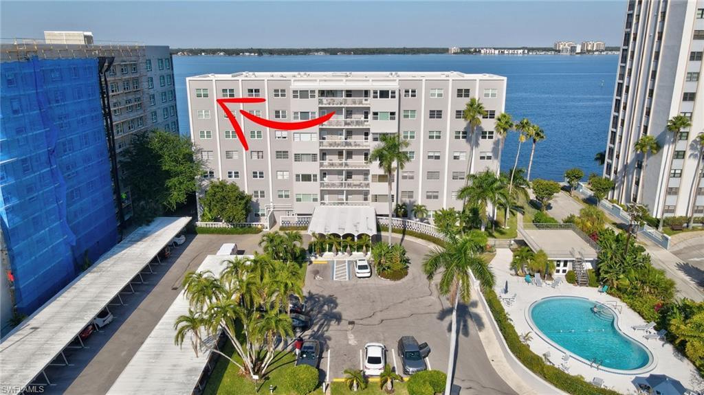 Image 1: Bird's eye view of The Riverside Club condo, river, heated pool & parking