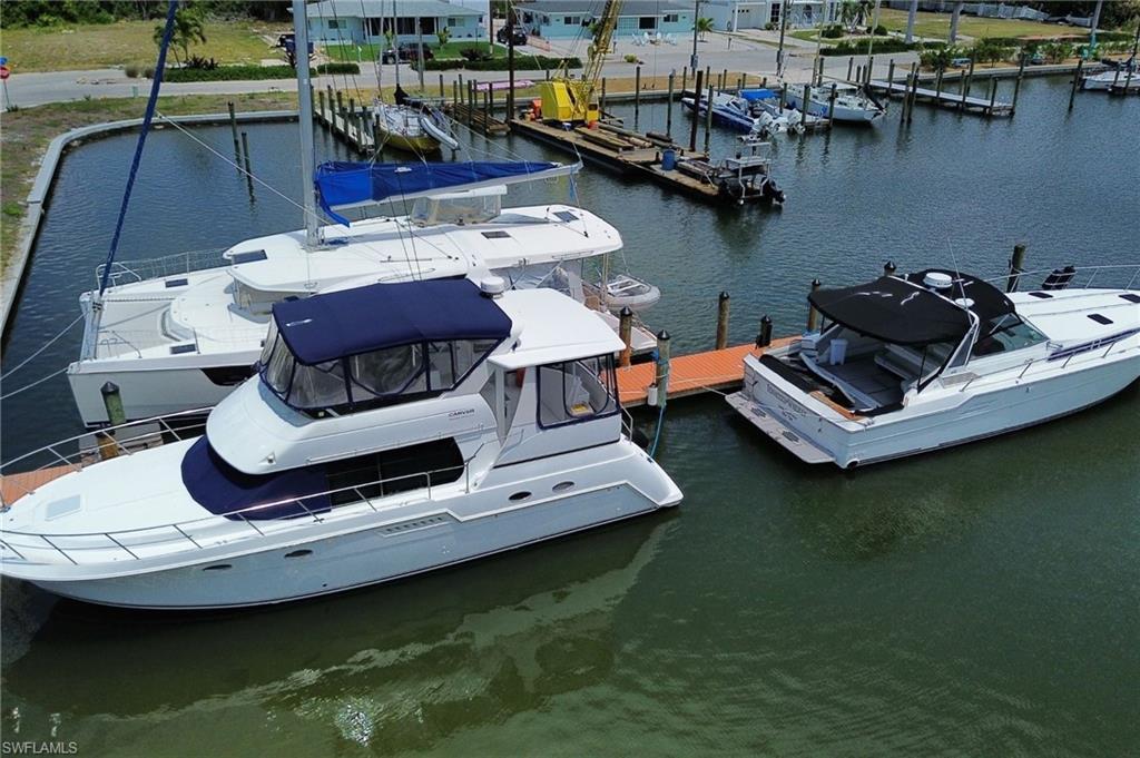 Image 3: Dock with a water view and view of marina