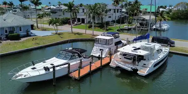 Image 4: Dock area with a water view and a residential view