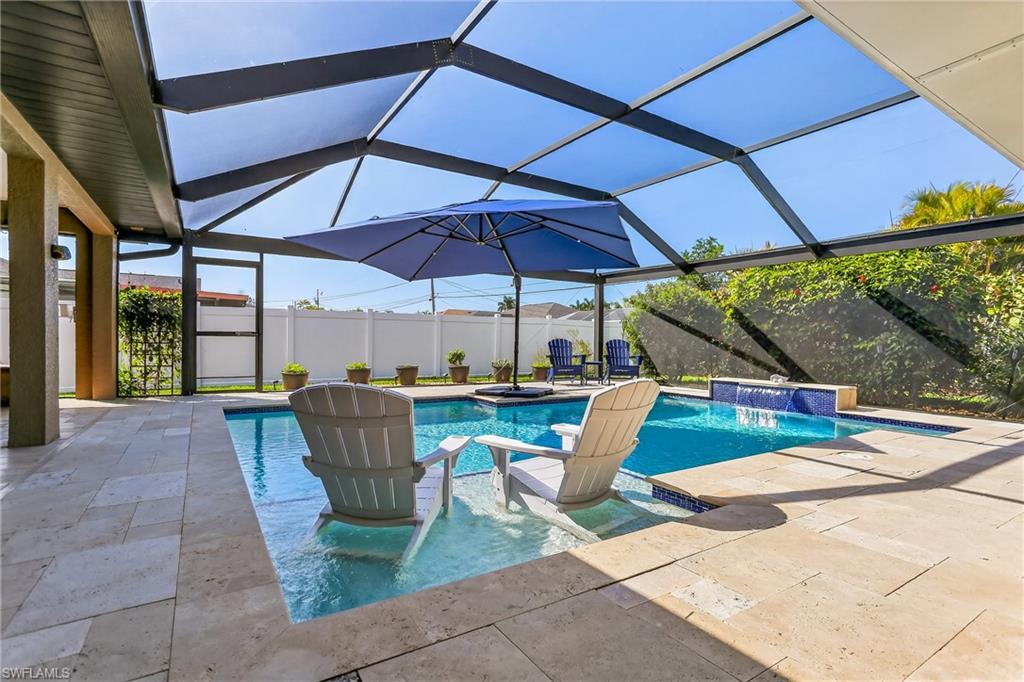 Image 1: Pool with sun shelf and travertine deck!