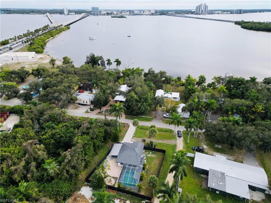 Image 3: Aerial view of property and surrounding area featuring a large body of water