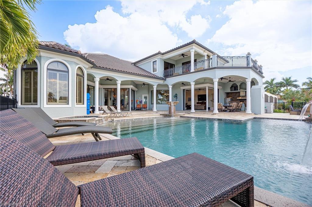Image 1: This home is beautiful.  One of the largest pool decks in town.