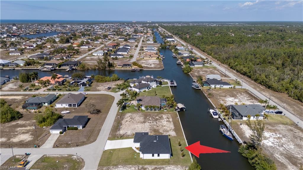 Image 3: Aerial view of property's location featuring nearby suburban area