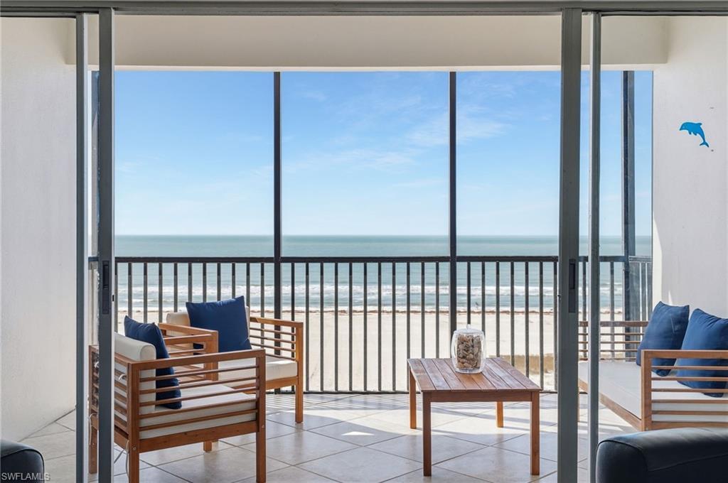 Image 3: The private balcony is the perfect place to relax, unwind, and take in the Gulf breeze.