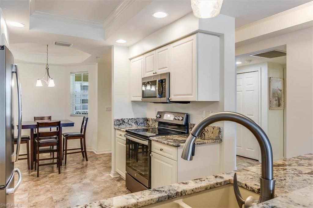 Image 4: Kitchen open to dining area