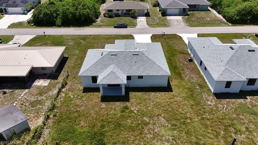 Image 3: New construction property featuring a light-colored shingle roof and a covered entryway