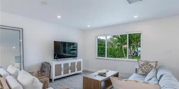 Image 4: Living room with baseboards, visible vents, carpet flooring, and recessed lighting