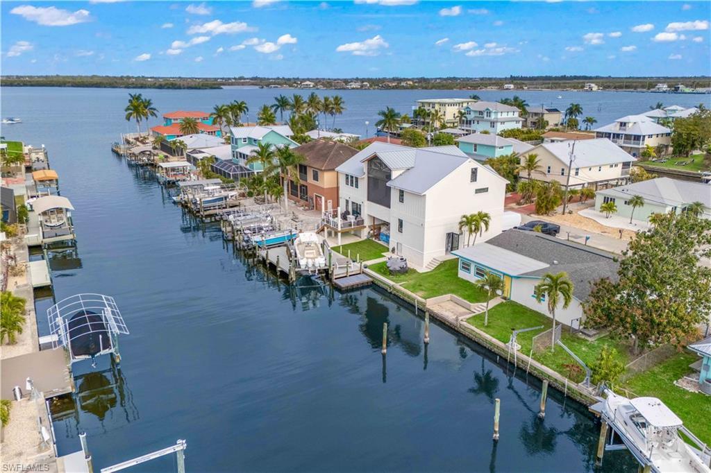 Image 3: Stunning aerial view showcasing Matlacha&rsquo;s vibrant waterfront lifestyle.