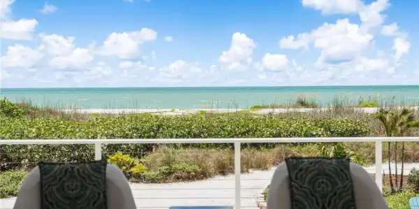 Image 2: Welcome to 4577 Waters Edge Lane, a beautifully renovated beachfront retreat on Sanibel Island.