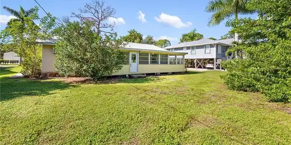 Image 3: Enclosed Florida room expands the home&rsquo;s usable living space and overlooks the spacious yard.