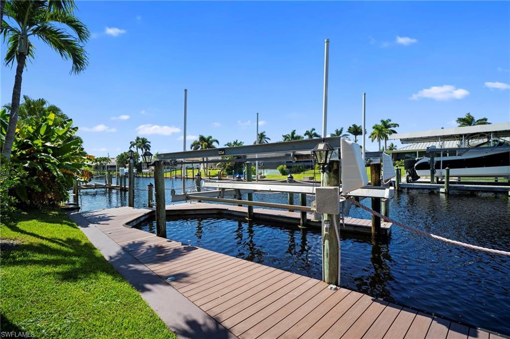 Image 3: Dock with boat lift and a water view
