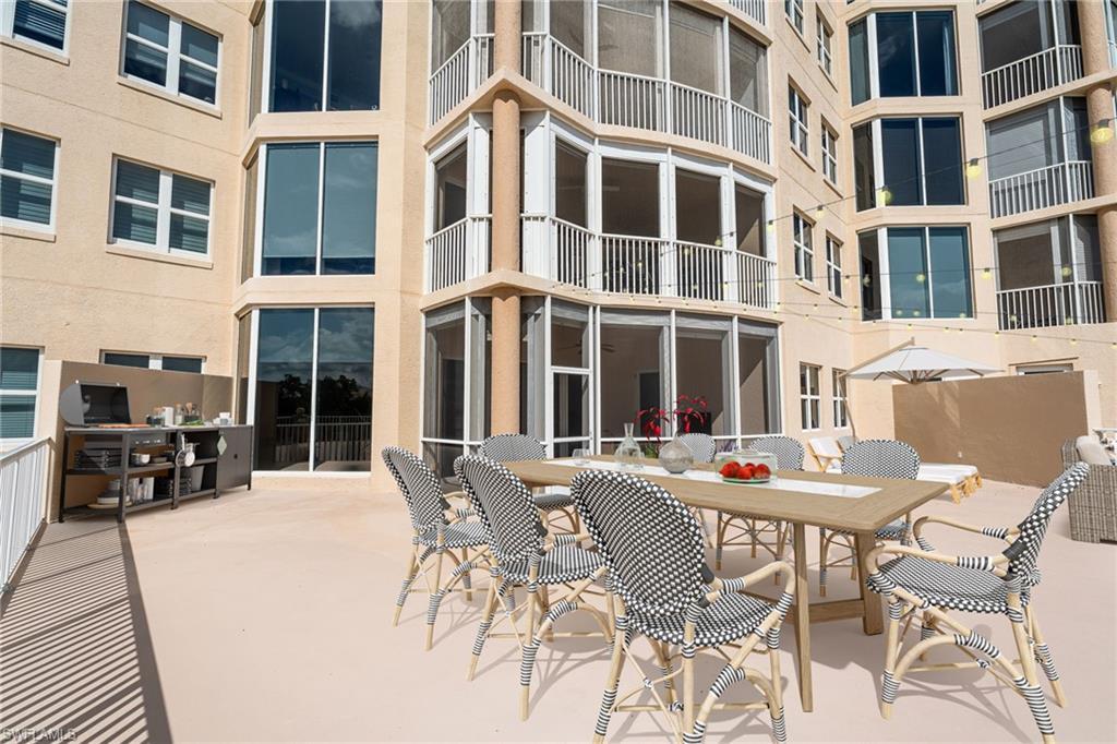 Image 2: Private 2000 sq ft Patio / Terrace  sunroom, outdoor dining area, and a patio